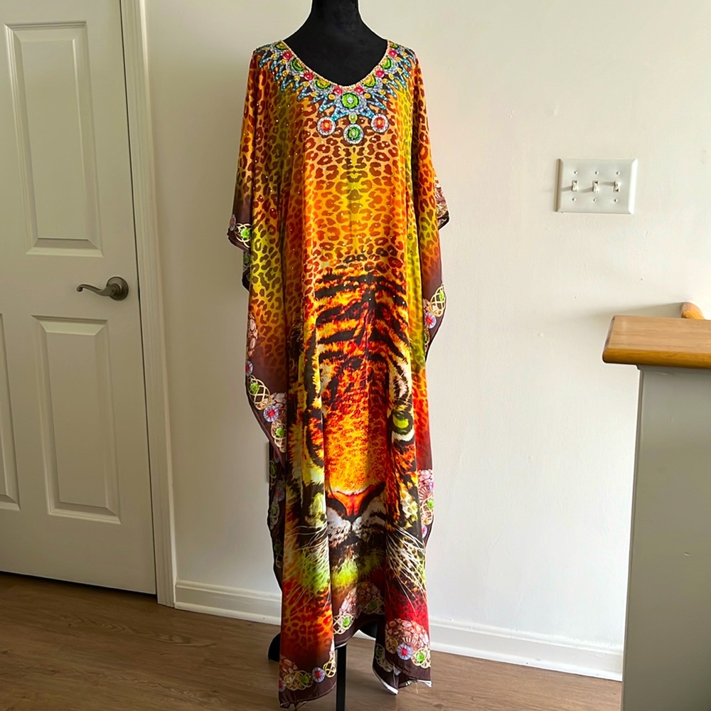 Long soft and light silk animal print kaftan with crystal stones.